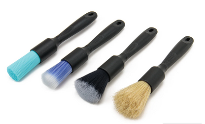 Set of four detail brushes with black handles and different colored bristles for precise cleaning tasks and delicate surfaces.